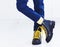 Stylish look of patent leather ankle boots with yellow shoelaces and socks at young boy