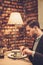 Stylish man eating at restaurant.