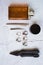 Stylish men`s rings, pen, tools, handkerchief, pomade and perfume for grooming. Metrosexual ccessories on concrete background.