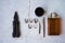 Stylish men`s rings, pen, tools, handkerchief, pomade and perfume for grooming. Metrosexual ccessories on concrete background.