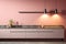 Stylish minimalist kitchen interior in soft pastel pink tones with natural daylight illumination