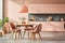 Stylish minimalist kitchen interior in soft pastel pink tones with natural daylight illumination