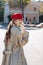 Stylish model with long dark hair wearing bright red beret