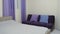Stylish modern design of the bedroom in purple and blue colors