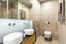 Stylish, modern en suite bathroom interior with beige marble til