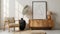 Stylish, modern living room interior with wooden commode, tropical leaf in ceramic vase, and elegant personal accessories,