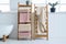 Stylish modern wooden rack with drying bathroom towels, AI generative