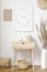 Stylish neutral interior of living room with white mock up poster frame, elegant rattan accessories, wooden shelf, hanging decor.