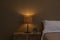 Stylish night lamp on bedside table in bedroom