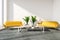 Stylish office lounge with yellow couches