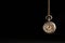 Stylish pendulum on black background, space for text. Hypnotherapy session