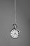 Stylish pendulum on grey background. Hypnotherapy session