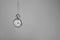 Stylish pendulum on light grey background, space for text. Hypnotherapy session