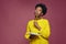 Stylish pensive african american girl pondering idea to write into notebook, thinking over business plan, to-do list