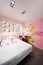 Stylish pink bedroom with double bed