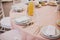stylish pink table with wine glasses, cutlery, napkin and delicious food and drinks. luxury catering in restaurant. modern