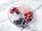 Stylish plate with frozen fruits on light marble table