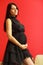 Stylish pregnant woman in black.