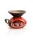 Stylish red ceramic candlestick with reflection