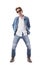 Stylish redhead male fashion model in jeans with sunglasses and boots posing and bending backwards.