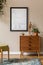 Stylish retro composition of living room with black mock up poster frame.