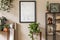 Stylish retro home staging of living room with black mock up poster frame.