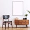 Stylish and retro living room with design vintage wooden commode, chair and elegant personal accessories. Mock up poster.