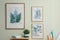Stylish room interior with floral paintings