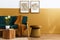 Stylish scandinavian interior of living room with design green velvet sofa, gold pouf, wooden furniture, cacti, carpet.