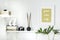 Stylish scandinavian interior with white shelf, white mock up poster frame, books, hourglass, camera, paper boxes, drummer sticks.