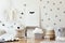 Stylish scandinavian kid room with mock up poster, toys, teddy bear, plush animal, natural pouf and children accessories. Modern