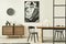 Stylish scandinavian living room interior of modern apartment with wooden commode, design table, chairs, carpet, abstract.