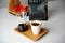 Stylish served specialty alternative black coffee. Bamboo tray, carafe. Ceramic cup without a handle. Aesthetics coffee