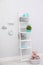 Stylish shelving unit near wall in child room