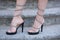 Stylish shooes on woman feet outdoor on stone stairs