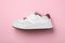 Stylish sneaker on pink background