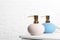 Stylish soap dispensers on table