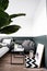 Stylish sofa corner in bedroom decorated in scandinavian style with well decorated / decoration idea / interior design / stylish
