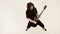 Stylish solo guitarist with dreadlocks on his head and in black clothes on a white background expressively playing the