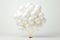 Stylish and sophisticated white and gold balloon floating gracefully on a pristine white background