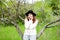 Stylish spring bohemian outfits. Wearing a white sweater and bla