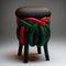 Stylish Stool Design with Dark Grey Braided Top, Red and Green Ribbon Accents, and Dark Green Legs. Generative AI