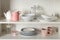 Stylish storage stand with different ceramic dishware