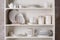 Stylish storage stand with different ceramic dishware