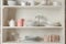 Stylish storage stand with different ceramic dishware