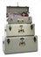 Stylish storage trunks with clothes and boots on white background. Interior elements