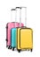 Stylish suitcases packed for travel on white background.