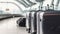 stylish suitcases standing in empty airport hall, unrecognizable traveller's luggage waiting in terminal, creative