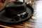 Stylish sunglasses and black beach hat on wooden table, summer t