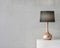 Stylish table lamp mockup with black shade and gold stand